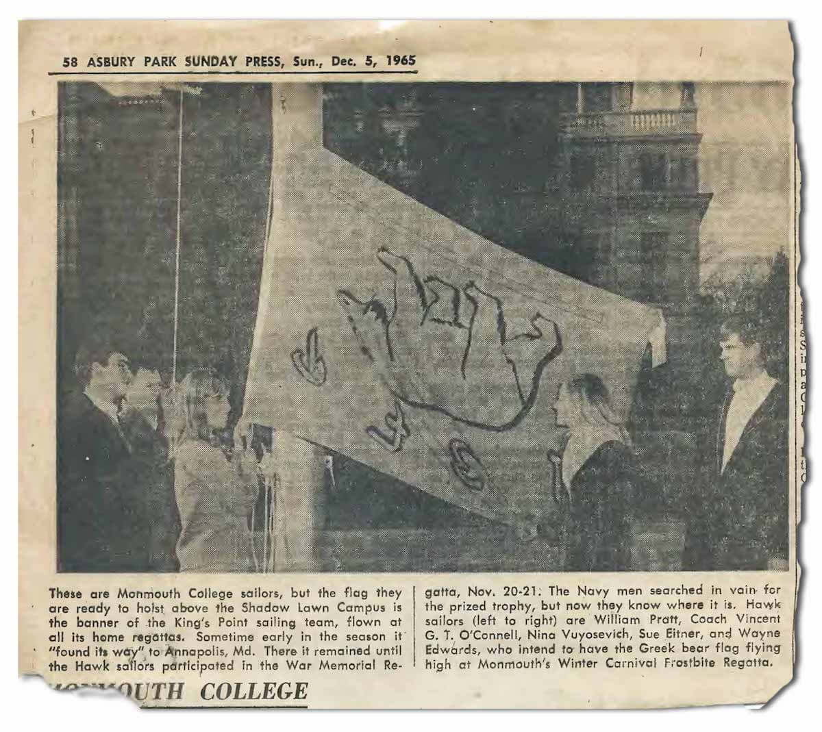 Monmouth College sailors hoisting the U.S. Merchant Marine Academy’s Greek bear flag