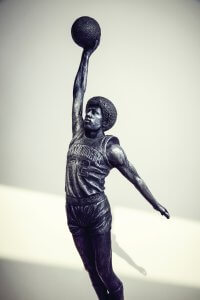 A sculpture of professional basketball icon Julius Erving going for a slam dunk