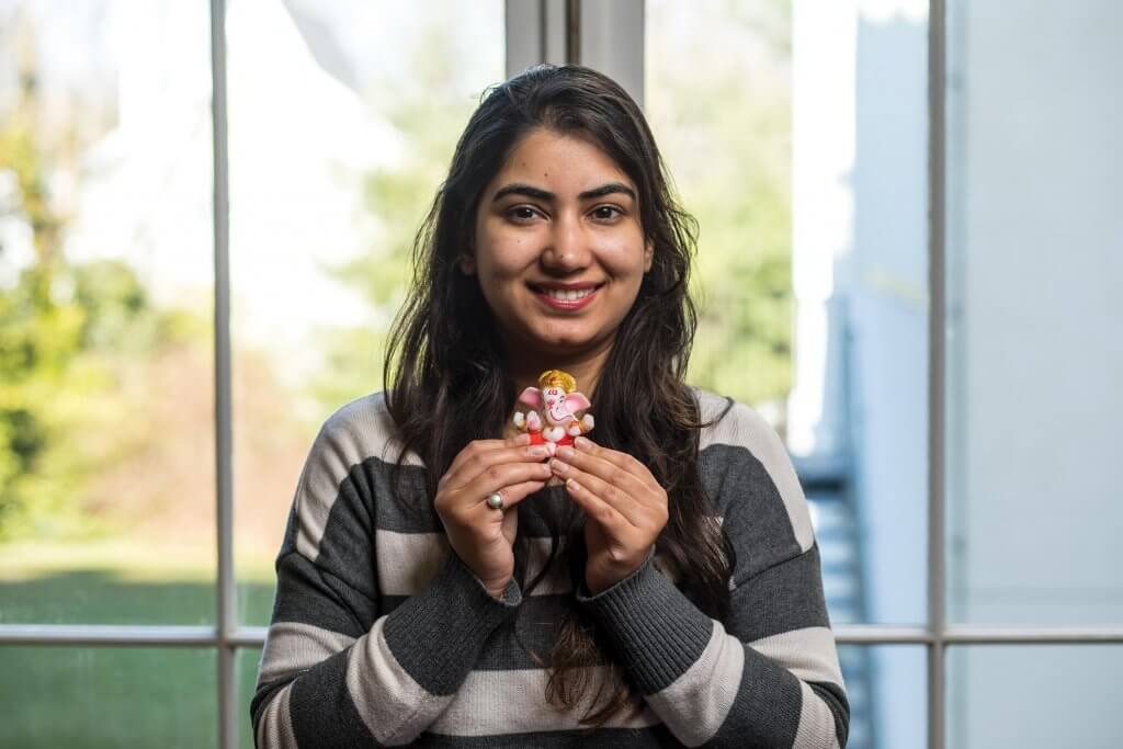 Ridhima Mehra with an idol of Lord Ganesha, a Hindu deity