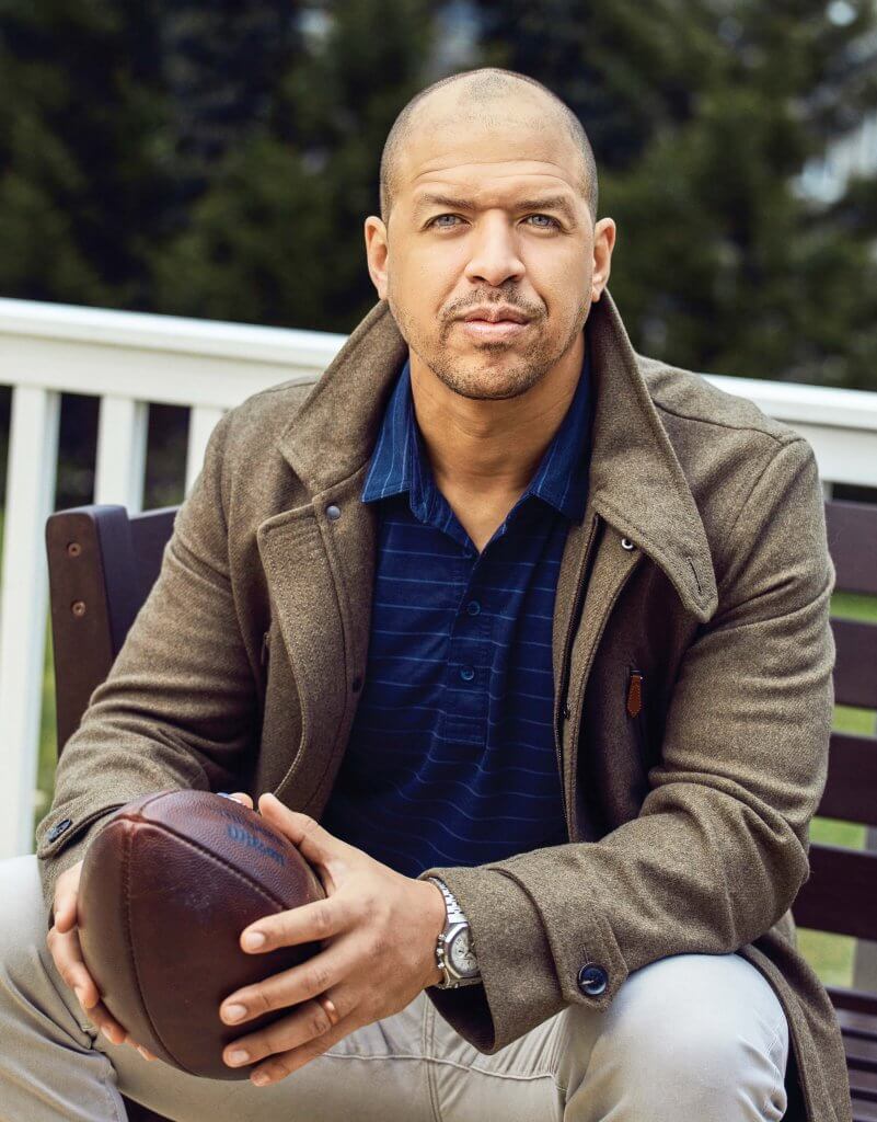 Miles Austin holding a football.