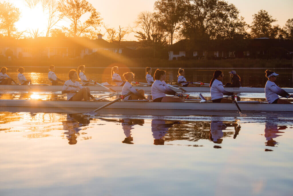 Photo showing two boats with Monmouth rowers on the water.