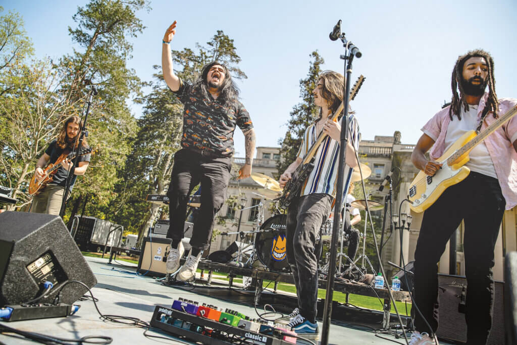 A 4-person band performing on Shadow Lawn during Springfest