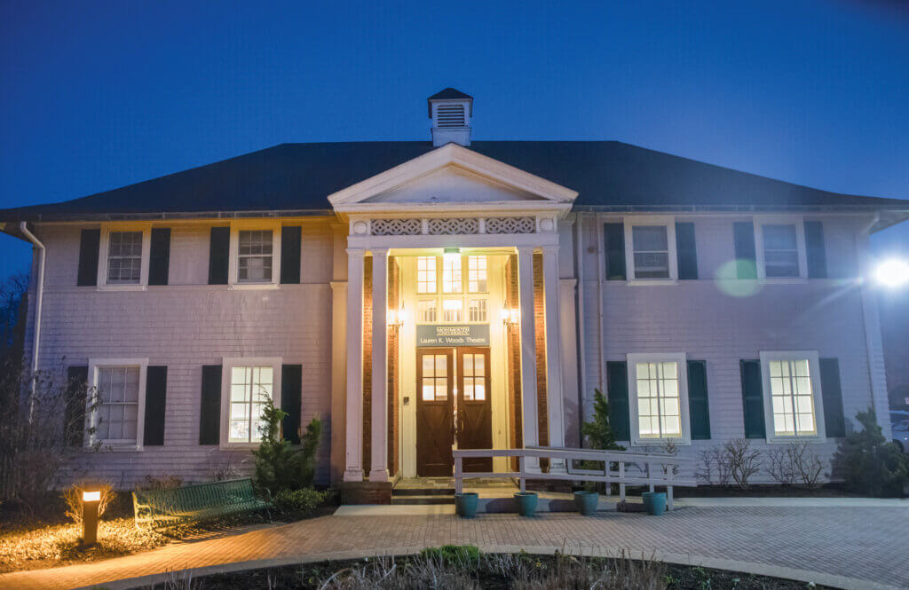 exterior of Woods Theatre at night