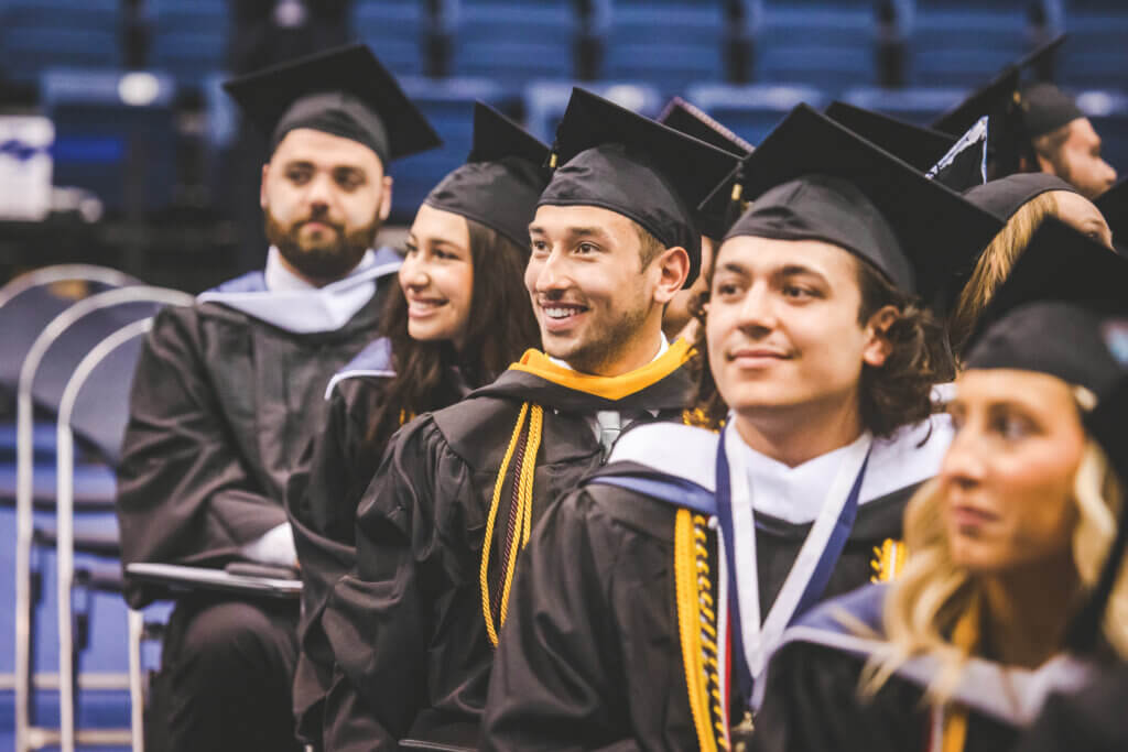 graduates in caps and gowns at commencement