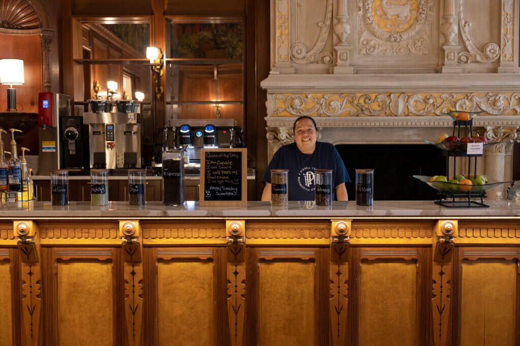 A barista behind the counter in Parson Cafe