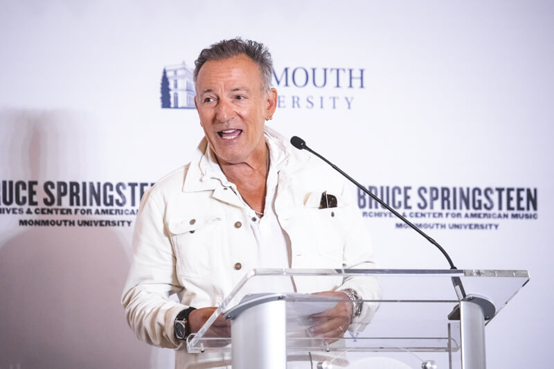 Bruce Springsteen standing at a podium
