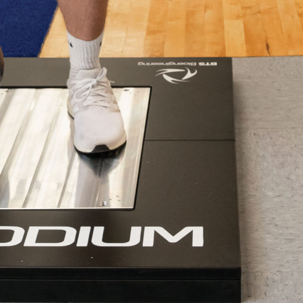 Close-up of a student standing on a force plate used to measure movement mechanics and ground reaction forces