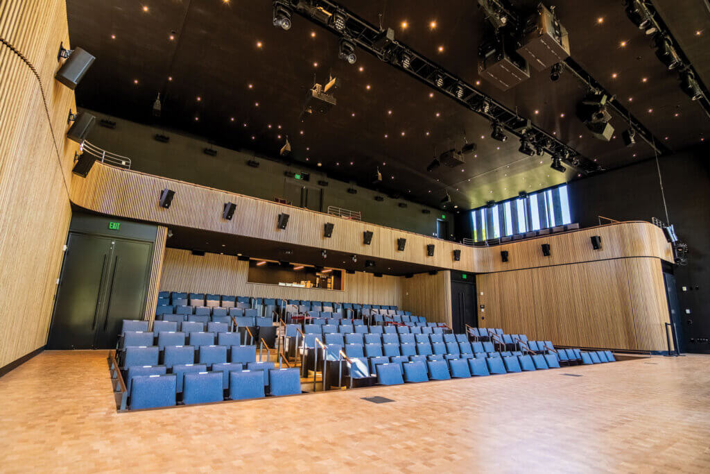 Interior of the 241-seat soundstage with tiered seating and stage inside the Bruce Springsteen Center for American Music