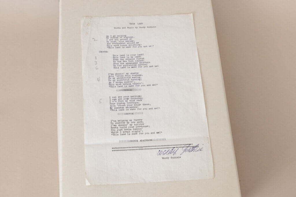 Typed lyrics for Woody Guthrie's "This Land Is Your Land," signed by the songwriter