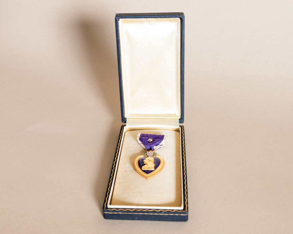 Purple Heart medal award displayed in a case