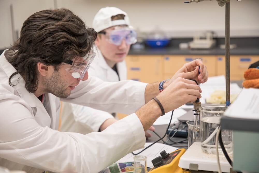 Photo shows Students work on an experiment in the General Chemistry Laboratory in the renovated and expanded Edison Science Building at Monmouth University.