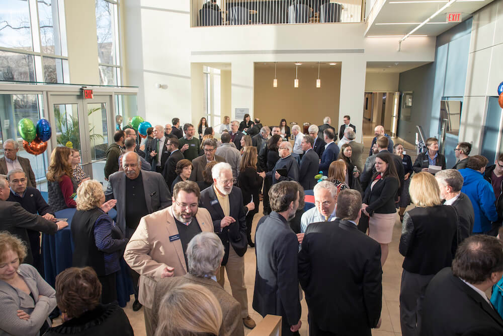 Photo shows guests gathering in the lobby of the new Edison Science Building to celebrate completion of the expansion and renovation of the university's science facilities.