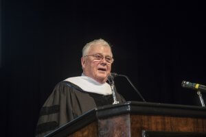 Photo of H. William Mullaney, Class of 1960, speaking at a podium