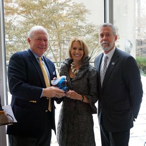 Pictured from left: UCI Director Tony MacDonald (left) and Monmouth University President Grey Dimenna present a Champion of the Ocean Award to National Academy of Sciences President Marcia McNutt.