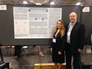 Photo shows Devyn Streisel '17 (left) with Greg Moehring, Ph.D., professor of chemistry (right), presenting her research at the 253rd American Chemical Society National Meeting in San Francisco.