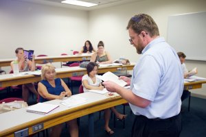 Professor Stanley Blair reading to a class