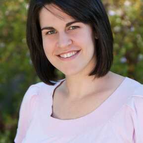 A headshot of Natalie J. Ciarocco outside with trees in the background. 