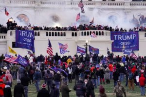 Rioters supporting then-President Donald Trump storm the Capitol on Jan. 6. (John Minchillo/AP)