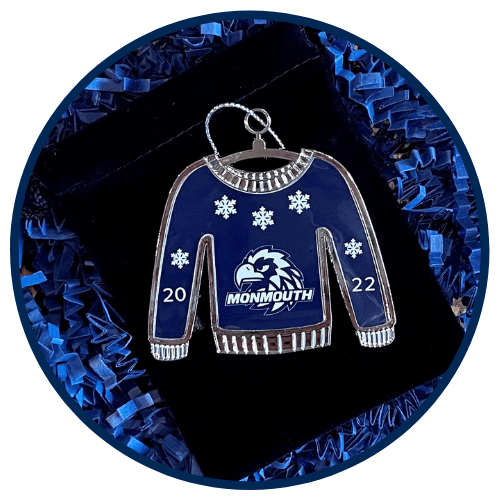 2022 Giving Tuesday Ornament is shaped like a sweater in Shadow blue with Monmouth Athletics Hawk logo.