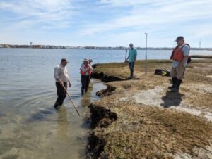 Group of researchers surveys Western Marshelder Island in the bay off Spray Beach