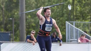 Man in athletic attire holding javelin