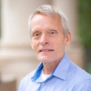 Head and shoulders image of man wearing blue shirt. Specialist Professor Rolf Kamp