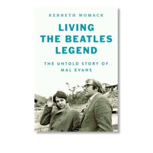 Book cover with title "Living the Beatles Legend" which has a picture of Paul McCartney and Mal Evans