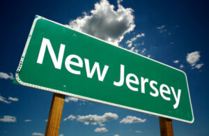 Green road sign reading "New Jersey"