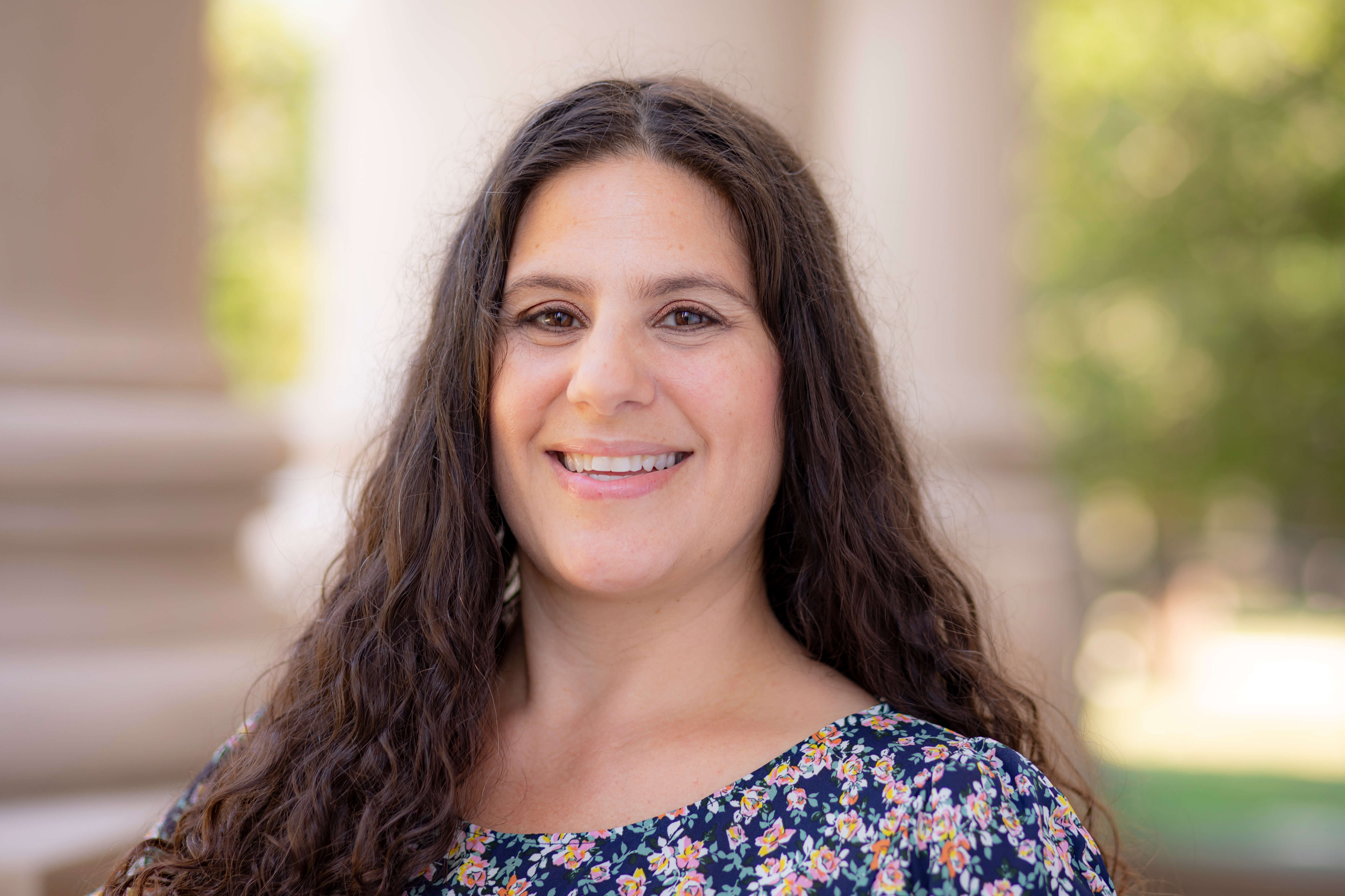 Professor Laura Giacobbe poses for headshot at Monmouth University