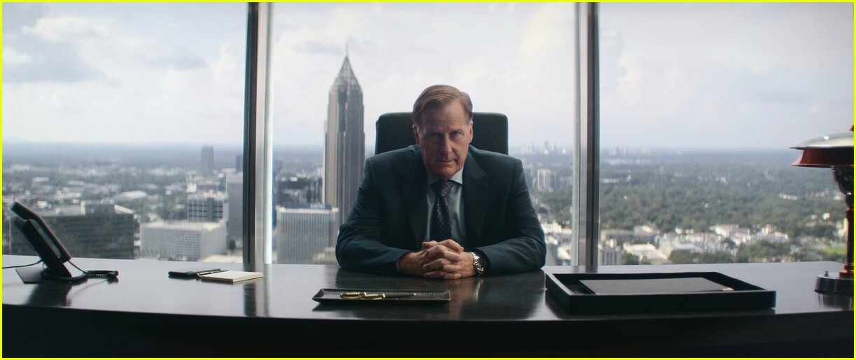 Jeff Daniels seated at desk in scene from Netflix series