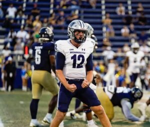 Monmouth quarterback Derek Robertson celebrates on the field during their game at FIU in Miami
