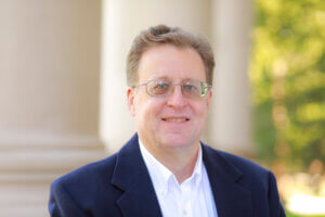 Prof. Stanley Blair on the porch of the Great Hall