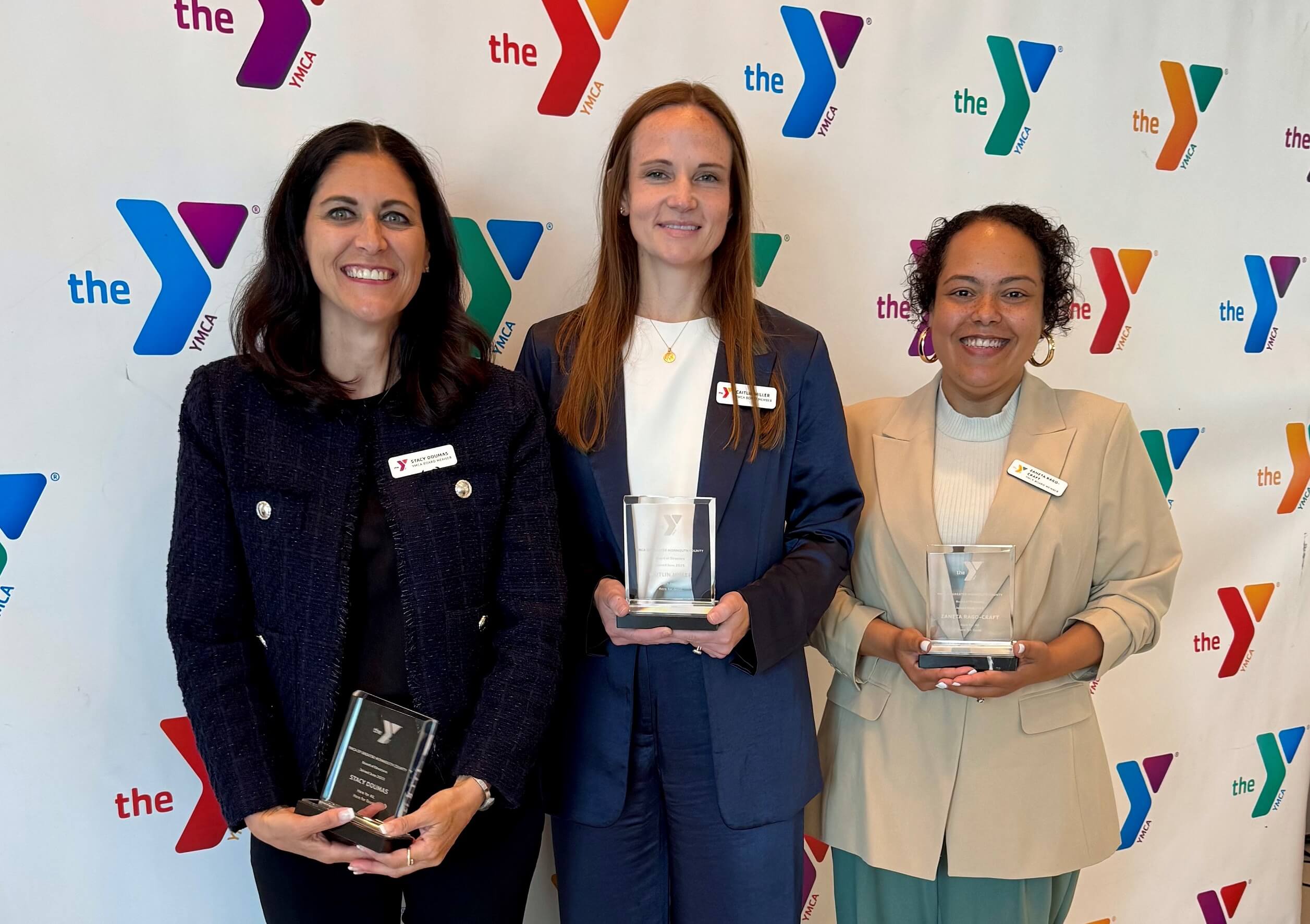 The women hold awards