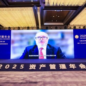 Prof. Rick Roberts on screen at economics conference in China