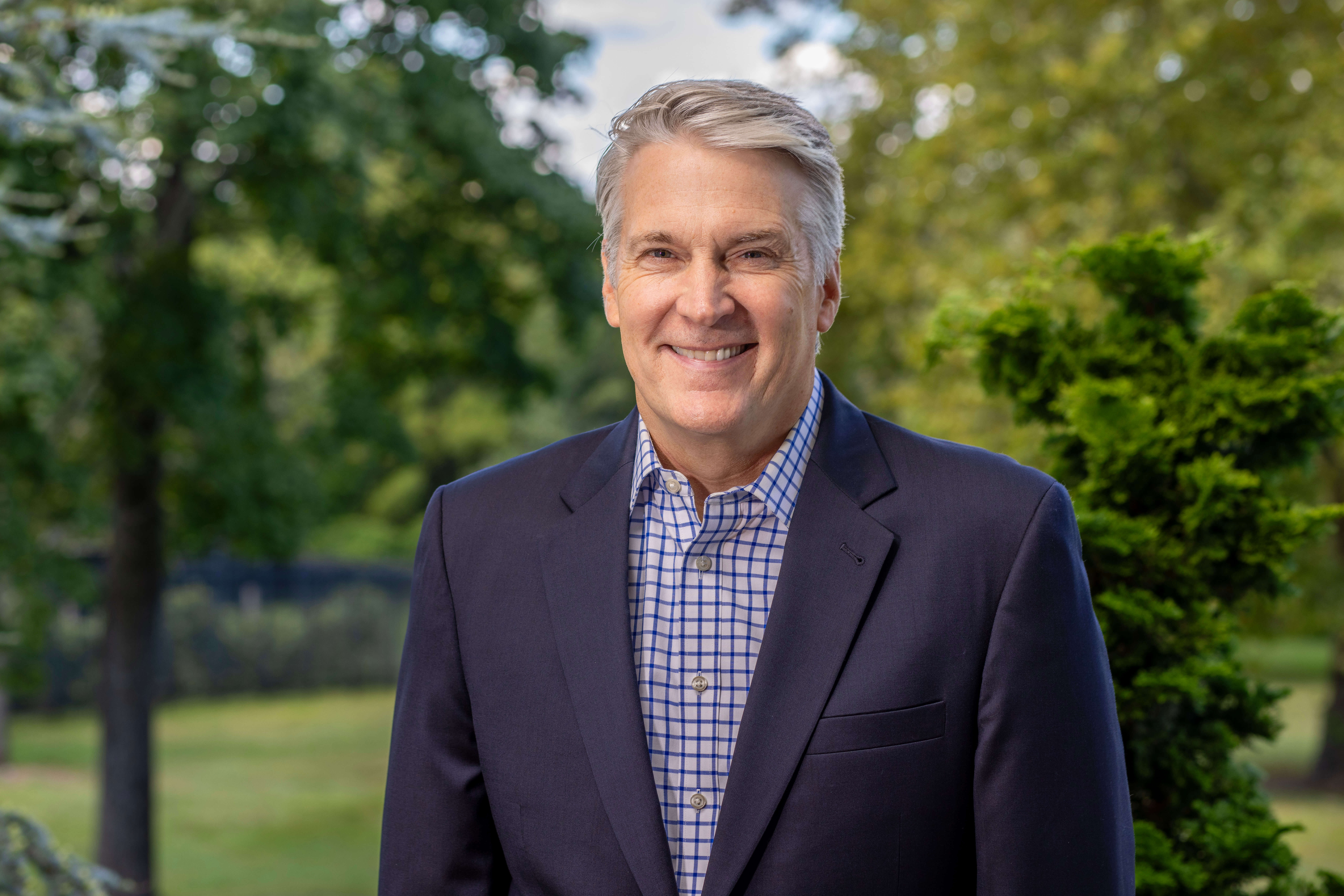 Monmouth University President Patrick F. Leahy posing for a photo on campus
