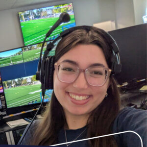 Chloe Gosk with a headset on working in the production studio