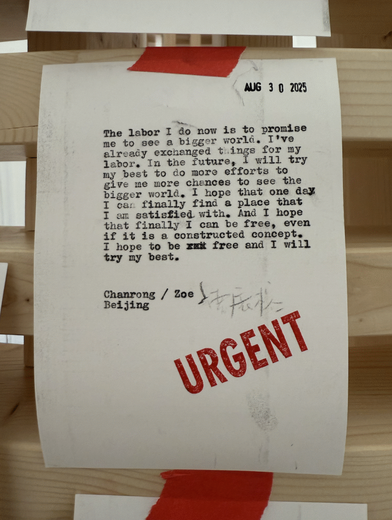 A postcard typed on a typewriter, where Chanrong/Zoe described the meaning of her labor.