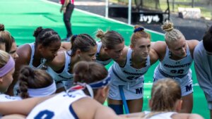Members of Field Hockey team in huddle