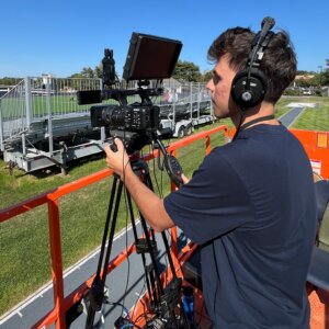 Student Vincent Macri filming a game