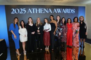 A group of women pose at an event for the 2025 ATHENA Awards