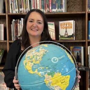 NJEA teacher of the year, Gillian Ober holding globe