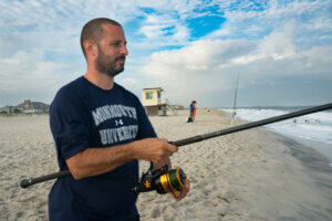 Professor Keith Dunton fishing on the Jersey Shore