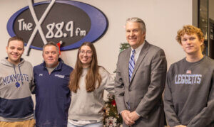 Student members of Monmouth Matters production crew (Frank Hoarle, Chloe Gosk, John Grano) with Prof. Matt Harmon and President Patrick Leahy