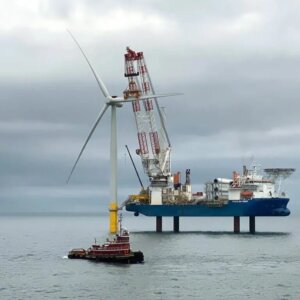 A wind turbine being constructed in the ocean