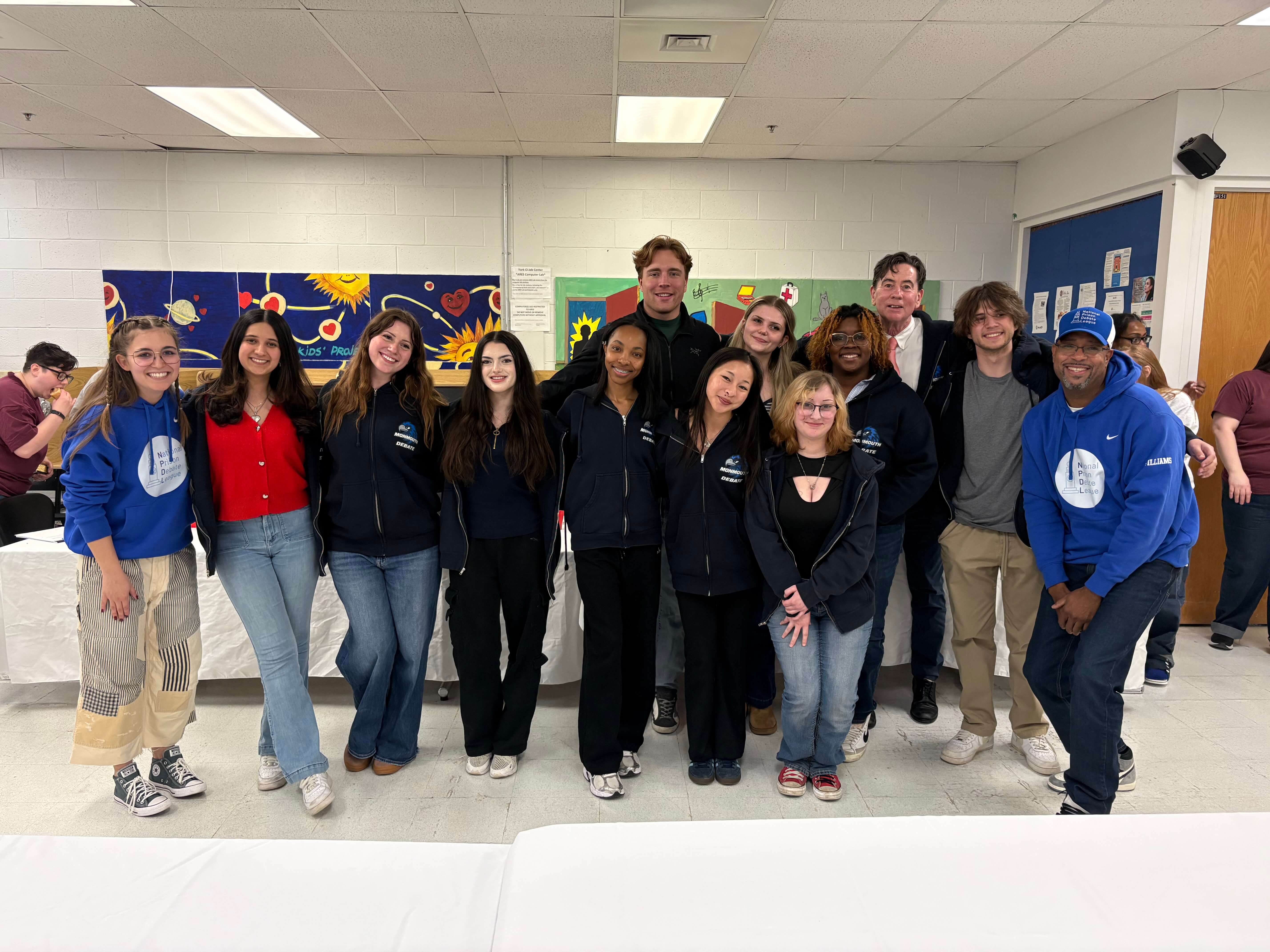 Monmouth University Debate Hawks with the members of the National Prison Debate League.