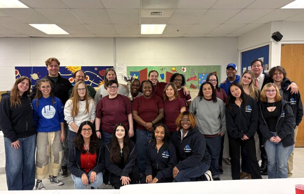Monmouth University Debate Hawks with the members of the National Prison Debate League.