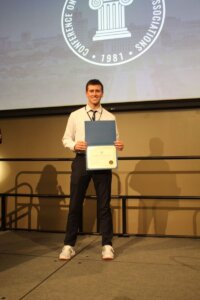Monmouth University SGA President Brendan Sheehan receiving the Student Body President of the Year award.