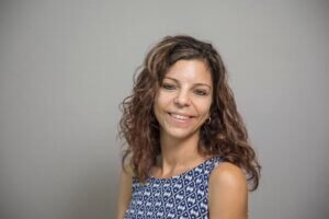 Woman smiling. Prof. Tina Paone