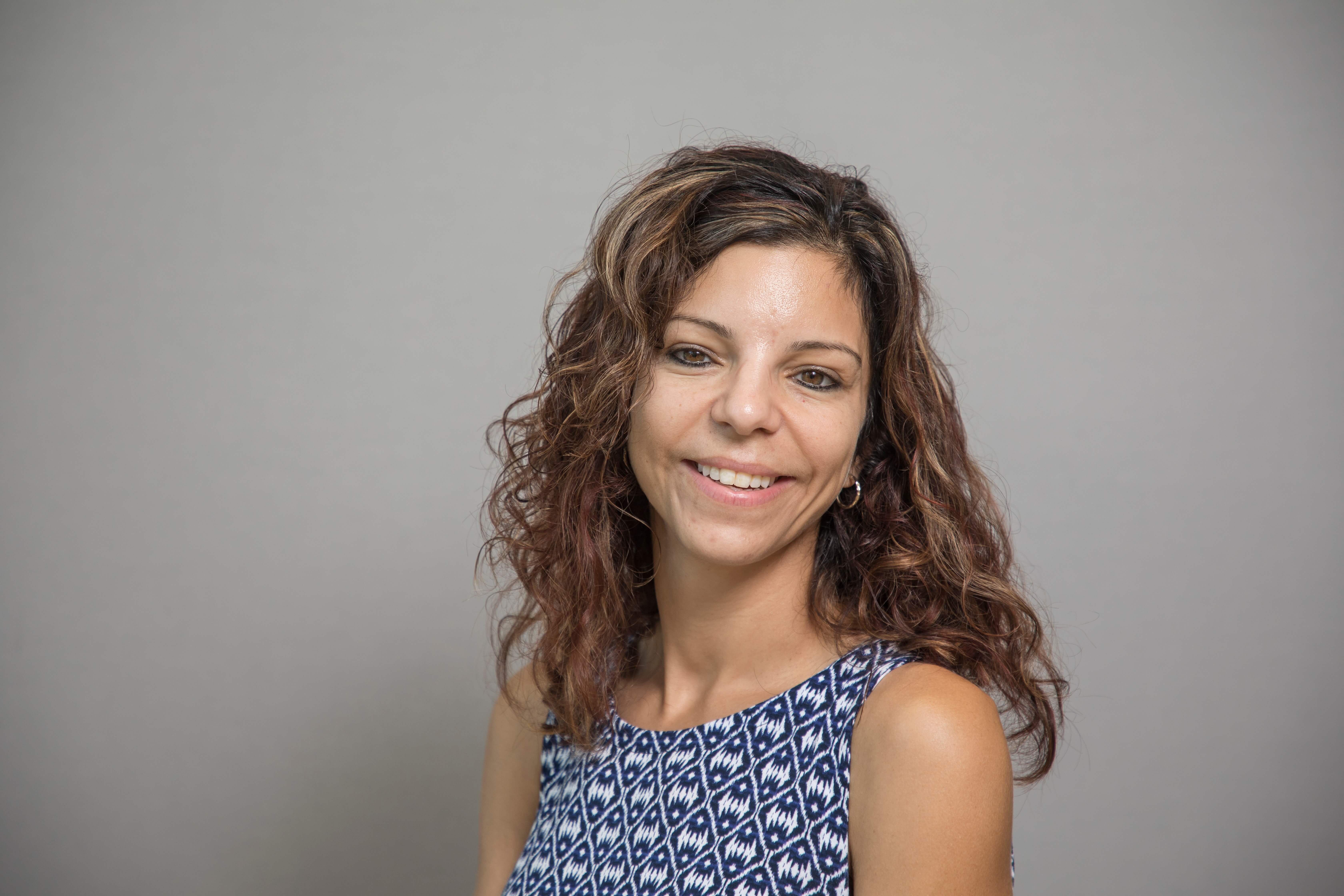 Woman smiling. Prof. Tina Paone