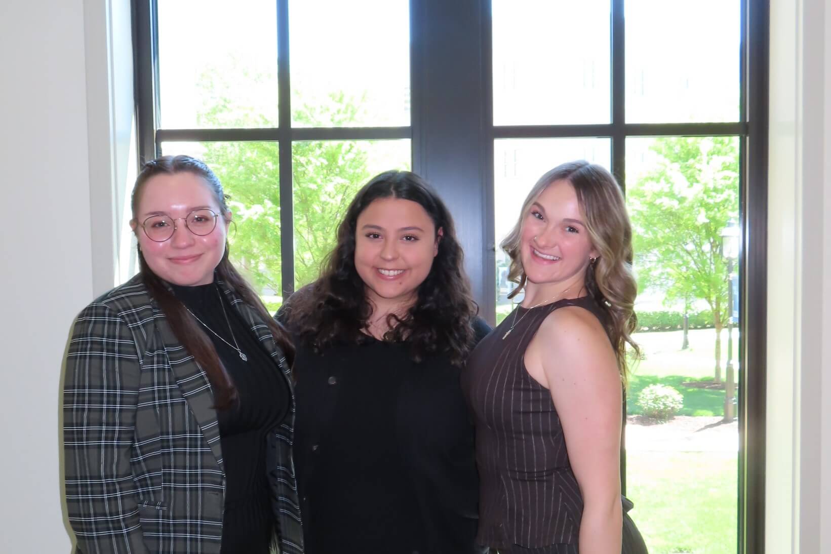 Monmouth University students Ana Heloisa Curatolo, Eleanor Carvalho, and Erin Downey